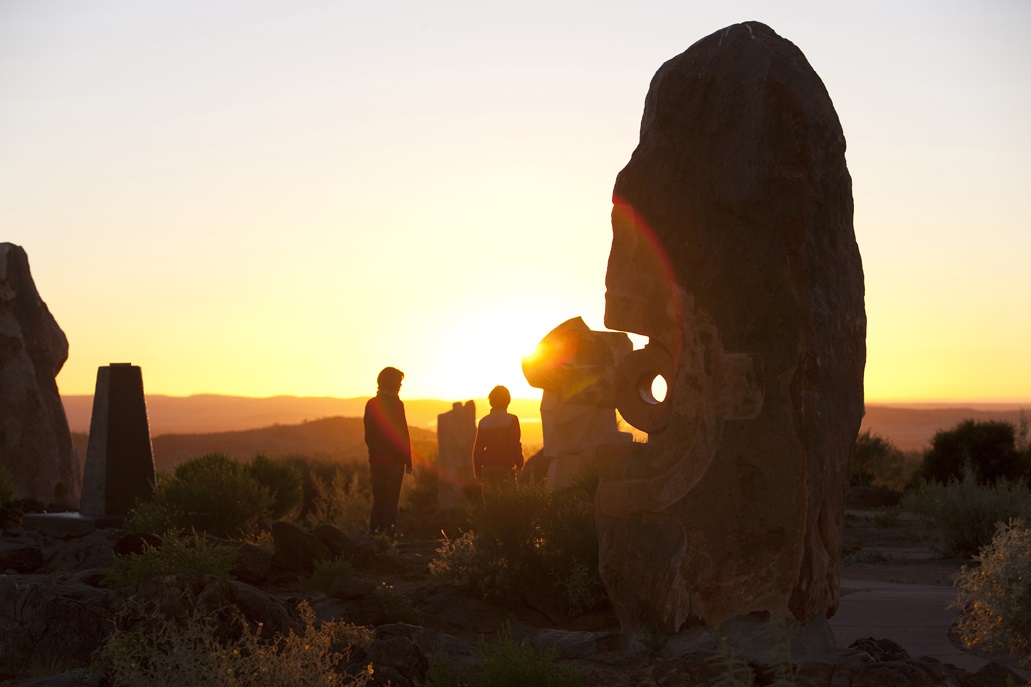 Image of Sculptures with kids at sundown